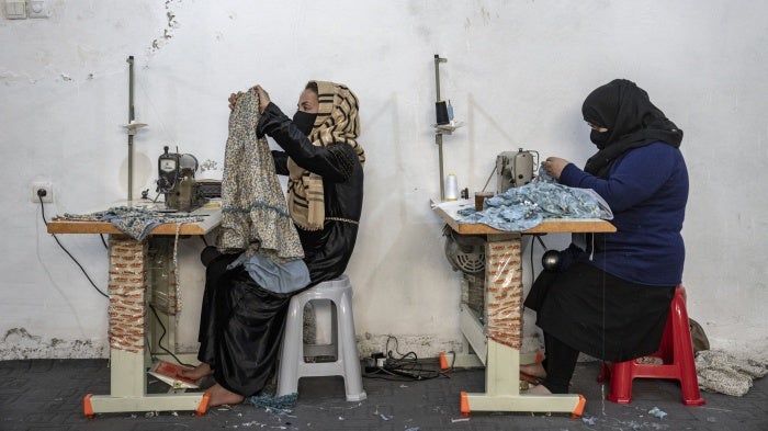 Afghan women work in a sewing workshop in Kabul, Afghanistan, March 6, 2023.