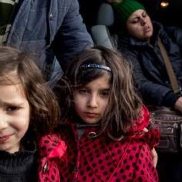 Two young Iranian sisters at the Idomeni border crossing between Greece and Macedonia. The border crossing is closed to all except those from Syria, Iraq, and Afghanistan who intend to seek asylum in Germany or Austria, stranding other asylum seekers and